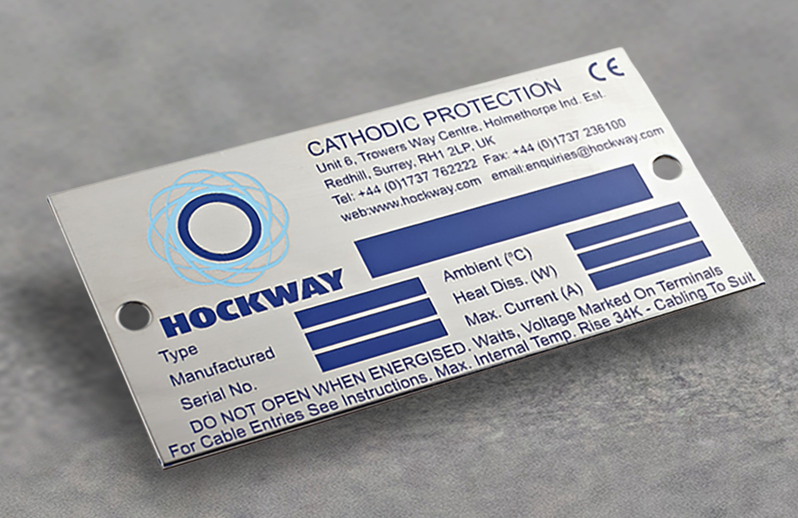 A grey stainless steel label with empty data fields.