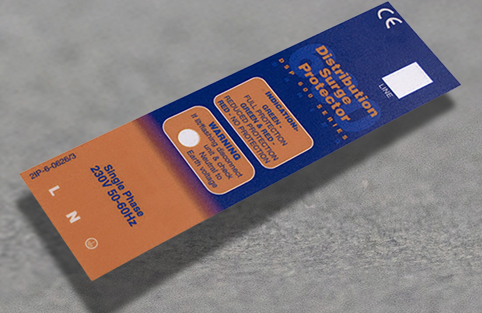 An orange and blue Polycarbonate label.