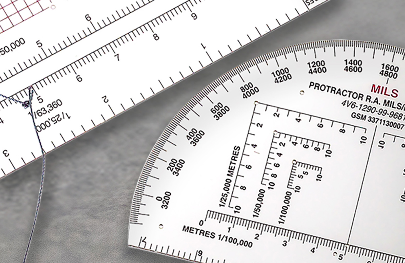 A set of acrylic measuring scaled with various markings on them.